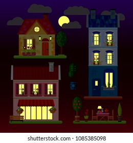 A set of flat illustrations of houses at night. One-storey, two-storey and three-storey building. Vector.