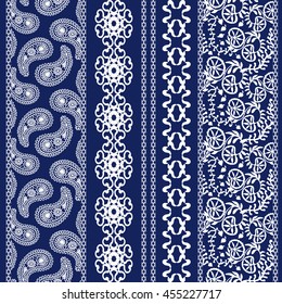 Set of floral batik borders. Damask seamless pattern, paisleys, leaves stripes, gypsy and ethnic motifs. Ethnic textile collection. White on dark blue. 