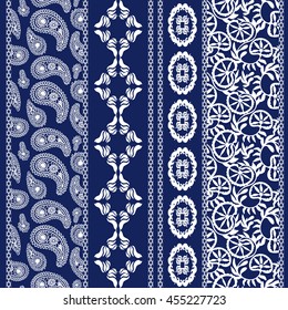 Set of floral batik borders. Damask seamless pattern, paisleys, leaves stripes, gypsy and ethnic motifs. Ethnic textile collection. White on dark blue. 