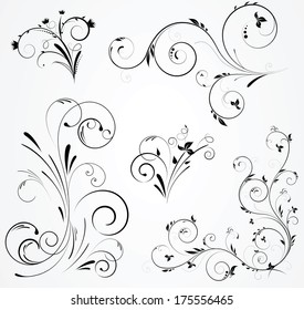 Set of floral black design with swirl elements on gray background