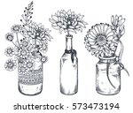 Set of floral compositions. Bouquets with hand drawn flowers and plants in vases and jars. Monochrome vector illustrations in sketch style.