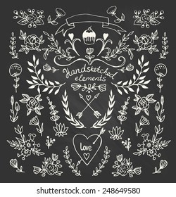 Set of floral hand-drawn elements on the chalkboard.