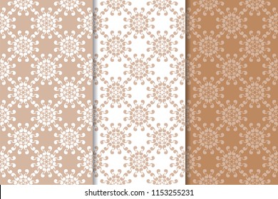 Set of floral ornaments. Brown, beige and white seamless patterns for textile and wallpapers