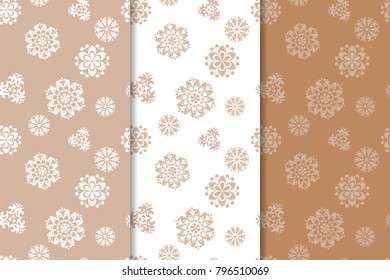 Set of floral ornaments. Brown, beige and white seamless patterns for textile and wallpapers
