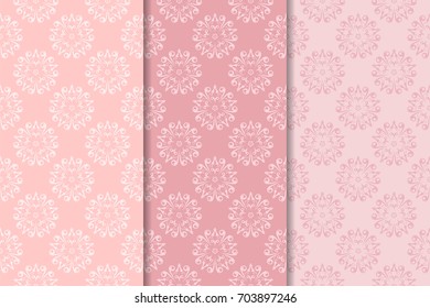 Set of floral ornaments. Pale pink vertical seamless patterns. Wallpaper backgrounds