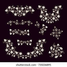 Set of floral vignettes and branches on dark background