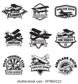 Set of flying academy emblems. Vintage airplanes. Design elements for logo, label, emblem, sign. Vector illustration.