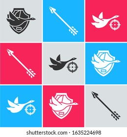 Set Flying duck on shield, Hipster arrow and Hunt on duck with crosshairs icon. Vector