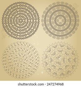 Set of four 4 ethnic colorful swirly design elements isolated on grunge background. Round pattern borders in collection. Vector illustration. Could be used for web-design, decoration, etc. 