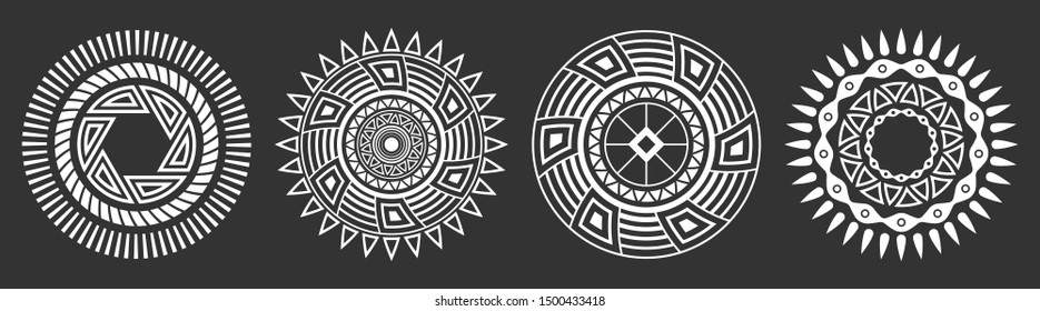 Set of four abstract circular ornaments. Decorative patterns isolated on black background. Tribal ethnic motifs. Stylized sun symbols. Stencil tattoo and prints Vector monochrome illustration.