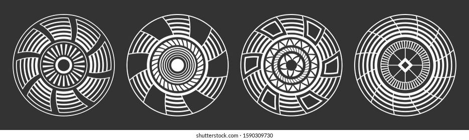 Set of four abstract circular ornaments. Decorative patterns isolated on black background. Tribal ethnic motifs. Stylized sun symbols. Stencil tattoo and prints Vector monochrome illustration.