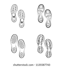 Set of four black dotted shoes prints isolated on white background