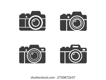 Set of four black flat icons representing classic digital cameras with different lens designs and body shapes for photographers and graphic designers projects