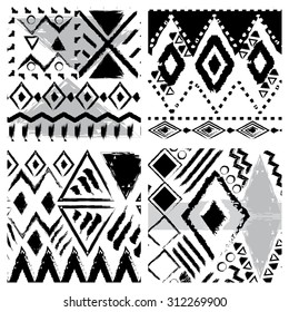 Set of four black and white hand drawn tribal seamless patterns. Vector backgrounds collection,pattern swatches included.
