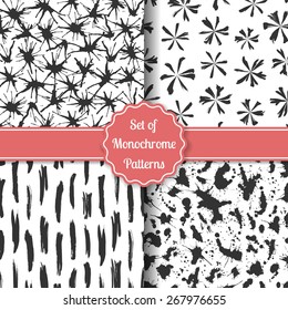 Set of four black-white stylish patterns. Monochrome geometric seamless patterns. Fashion grunge backgrounds. Vector illustration.