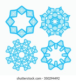 Set of four blue round ornaments. Ethnic mandalas. Vector art