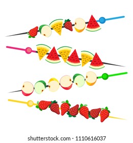A set of four canapes made of fruits and berries. Serving of strawberries, apple and watermelon. Healthy and healthy food. Food for a diet, treat or dessert. 1