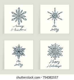 Set of four cards. Hand drawn snowflakes isolated on white. Winter holidays. Christmas. Backgrounds with decorative snow. It can be used for invitation, thank you message, postcard. Vector, eps10