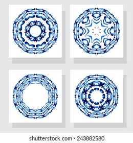 Set of four ceramic tile, in blue-white style .Floral circle pattern. Nice hand paint wreath. Isolated on grey background 