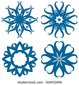 Set of four circular patterns or mandalas as a snowflakes. New Year, Christmas, winter design, ice star or snow on isolated background.