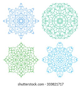 Set of four cold color lacy eastern round ornaments mandalas isolated over white