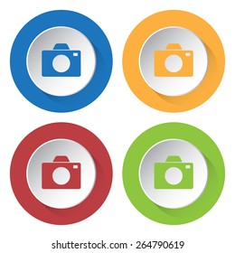set of four colored icons with camera and stylized shadows