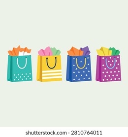 A set of four colorful gift bags with handles and tissue paper in a flat vector illustration style.