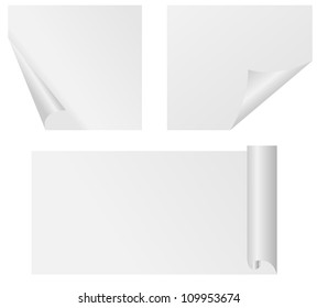 Set of four curled corners of white sheet