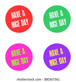 Set of four different colored stickers with the inscription HAVE A NICE DAY in bright red, green, pink and purple colors.