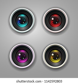 Set of four digital camera lenses, blue, red, yellow and magenta colors.