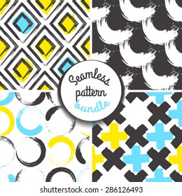 Set of four geometrical seamless patterns. Blue and yellow tones. Grunge style.