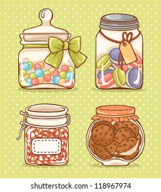 Set of four glass jars with candies and cookies.