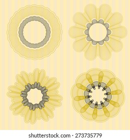 Set of four guilloche rosettes