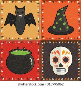 set of four halloween card decorations with bat, witches hat, cauldron and skull