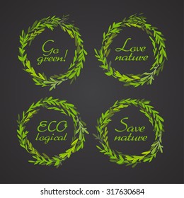 Set of four hand drawn green wreaths with ecology slogans . Vector illustration for graphic design.