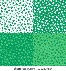 Set of four hand drawn seamless vector patterns with shamrocks, in green and white. Design concept for Saint Patrick's day celebration, kids textile print, wallpaper, wrapping paper.