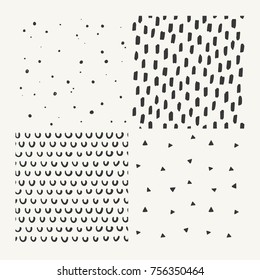 Set of four hand drawn seamless vector patterns. Ink doodle geometric backgrounds. Dots, confetti, triangles, shapes, arcs. 