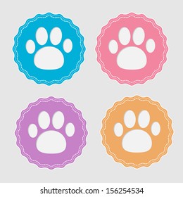 Set of four labels with paw print. Card. Vector illustration.