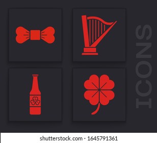 Set Four leaf clover, Bow tie, Harp and Beer bottle with four leaf clover icon. Vector