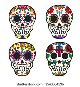 Set of four Mexican sugar skulls