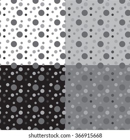 Set of four monochrome black and white seamless patterns. Vector drawing circles.