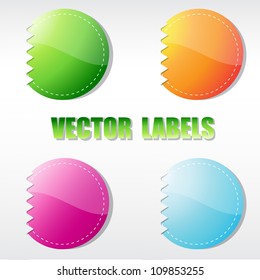 Set of four multicolored round labels. Vector format for your design