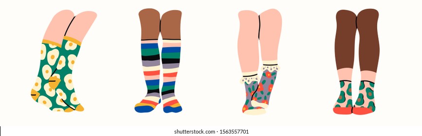 Set of four pairs of female or male legs in the socks. Cool various prints. Stylish underwear. Fashion accessories. Footwear. Hand drawn vector colored trendy illustration. Flat design