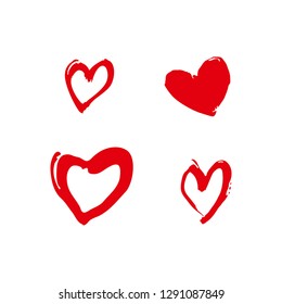 Set of four red freehand drawn hearts. Vector pattern imitation of drawing with a brush.
