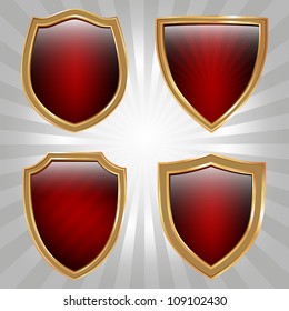 Set of four red and gold shields
