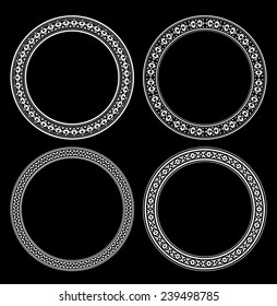 Set of four round decorative frames on a black background