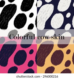 Set of four seamless bright patterns - colorful variations of cow skin