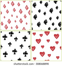 Set of four seamless hand drawn patterns with card suits