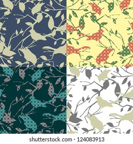 Set of four seamless patterns with birds and tree branches