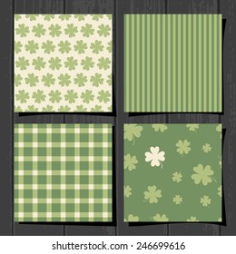 A set of four seamless patterns for Saint Patrick's Day on a gray wood background.